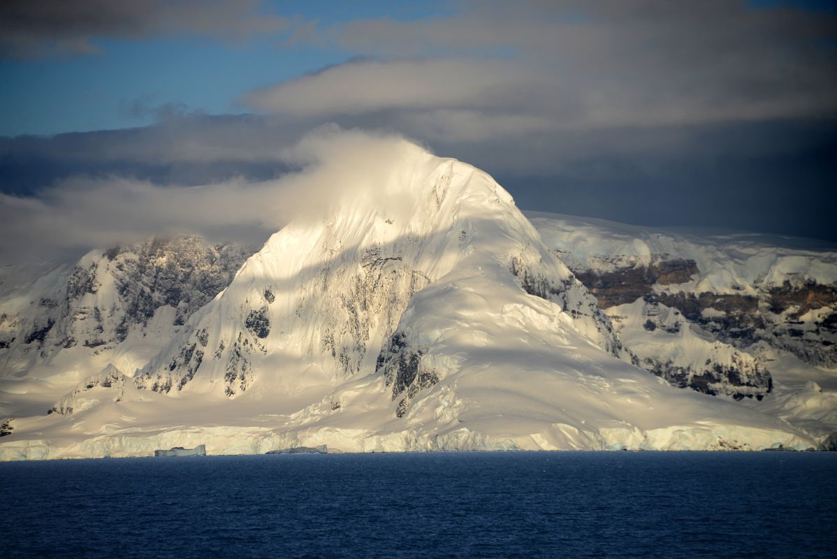 06 Sun Shines On A Glacier Clad Mountain On Anvers Island Near Cuverville Island From Quark Expeditions Antarctica Cruise Ship